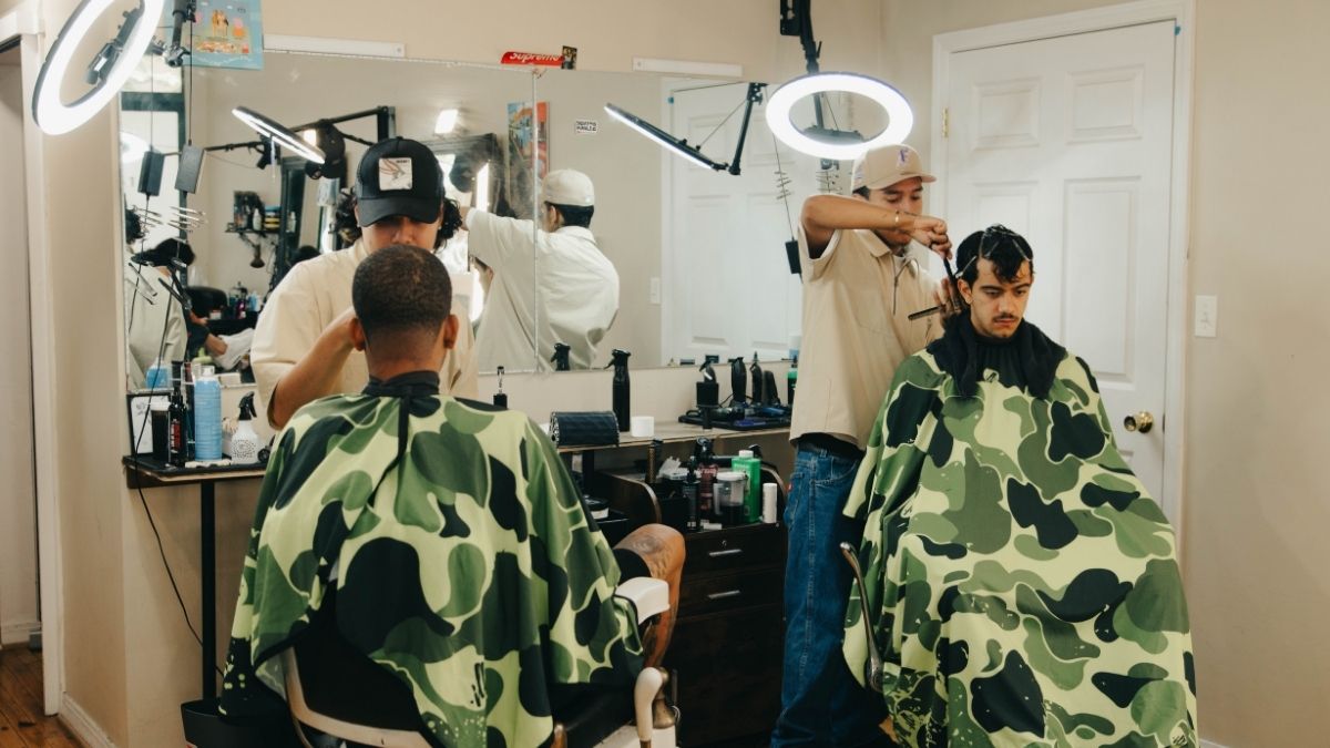 Barber discussing haircut with client